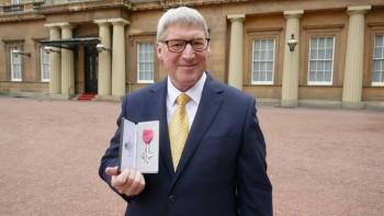 David Temple receiving his MBE at Buckingham Palace