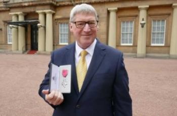 David Temple receiving his MBE at Buckingham Palace